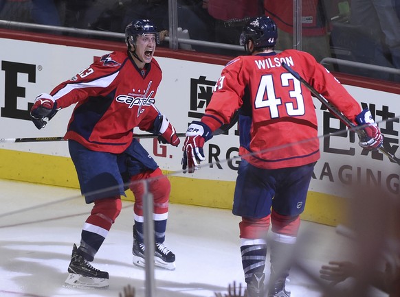 Washington Capitals right wing Tom Wilson (43) celebrates his overtime goal with center Jay Beagle (83) against the Toronto Maple Leafs during Game 1 of an NHL hockey Stanley Cup first-round playoff s ...