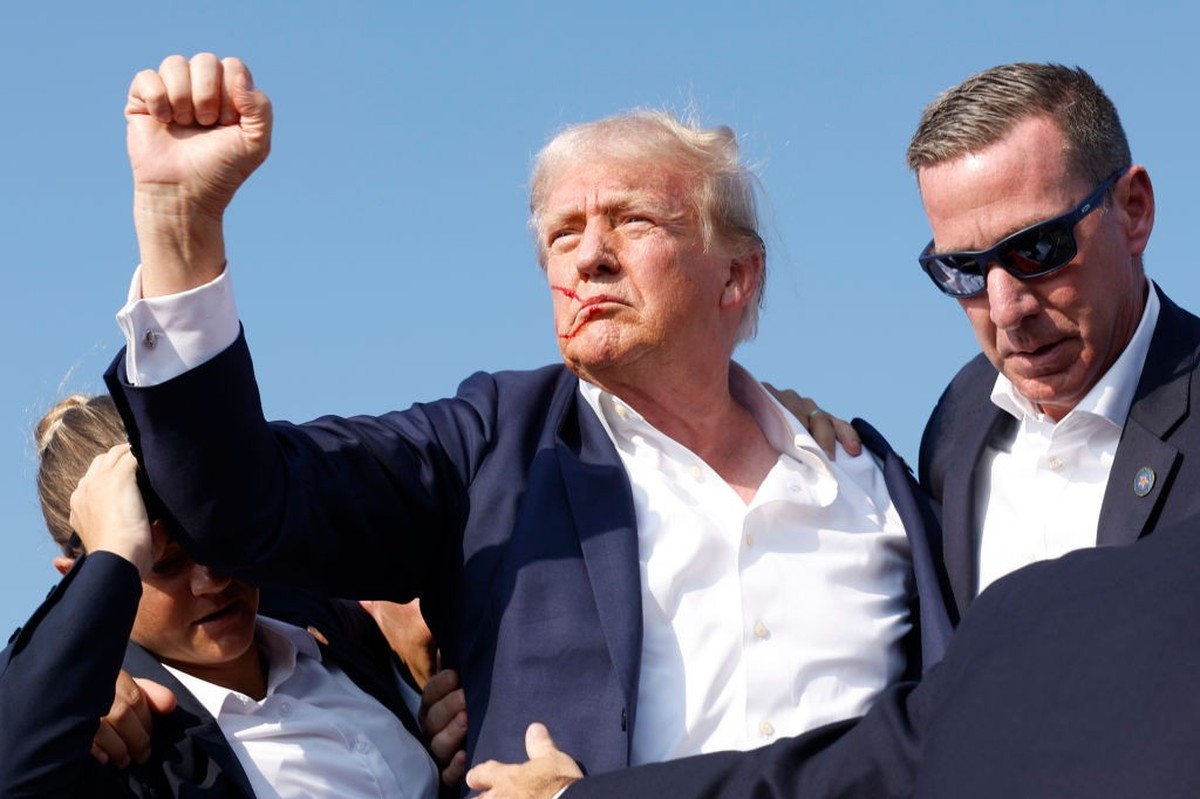 BUTLER, PENNSYLVANIA - JULY 13: Republican presidential candidate former President Donald Trump is rushed offstage during a rally on July 13, 2024 in Butler, Pennsylvania. Butler County district attor ...