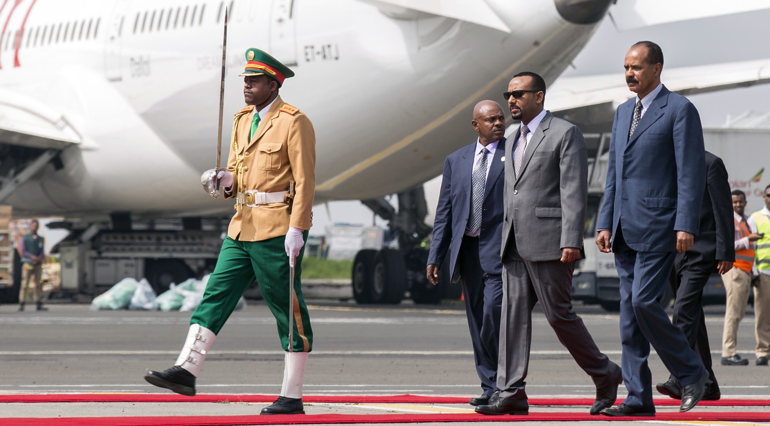 FILE - Eritrean President Isaias Afwerki, right is welcomed by Ethiopia&#039;s Prime Minister Abiy Ahmed, 2nd right, upon his arrival at Addis Ababa International Airport, Ethiopia on July 14, 2018. A ...