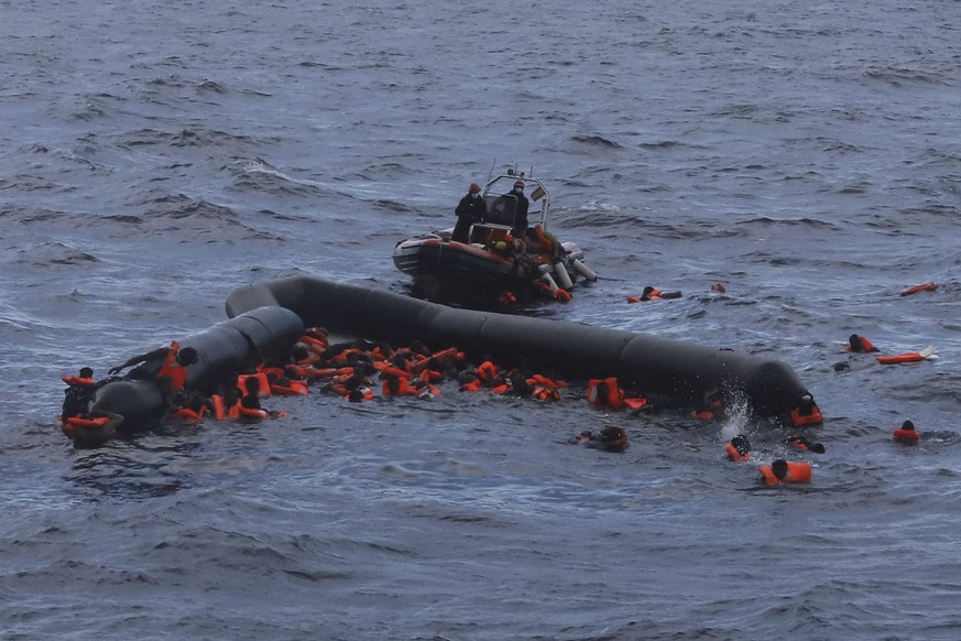 Refugees and migrants are rescued by members of the Spanish NGO Proactiva Open Arms, after leaving Libya trying to reach European soil aboard an overcrowded rubber boat in the Mediterranean sea, Wedne ...