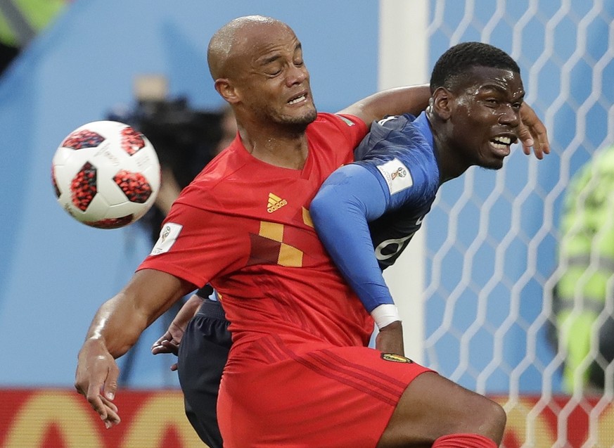 BelBelgium&#039;s Vincent Kompany, left, and France&#039;s Paul Pogba vie for the ball during the semifinal match between France and Belgium at the 2018 soccer World Cup in the St. Petersburg Stadium, ...