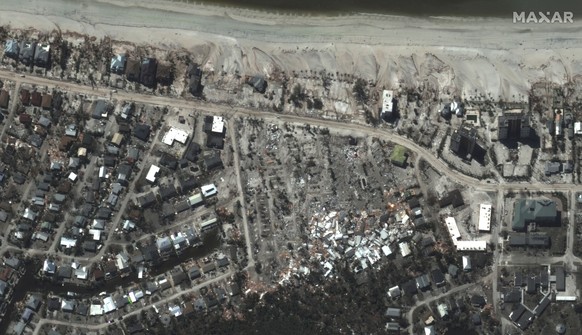 epa10216872 A handout satellite image made available by Maxar Technologies shows destroyed homes along Estero boulevard in Fort Myers, Florida, USA, 30 September 2022 after the passage of Hurricane Ia ...