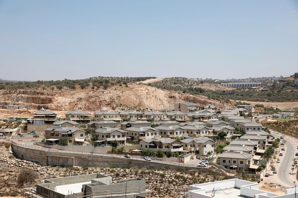 epa07784097 A general view residential neighborhood of Ramat Elkana the under construction in Israeli settlement of Elkana located in the north-western Samarian hills in the West Bank, 21 August 2019. ...