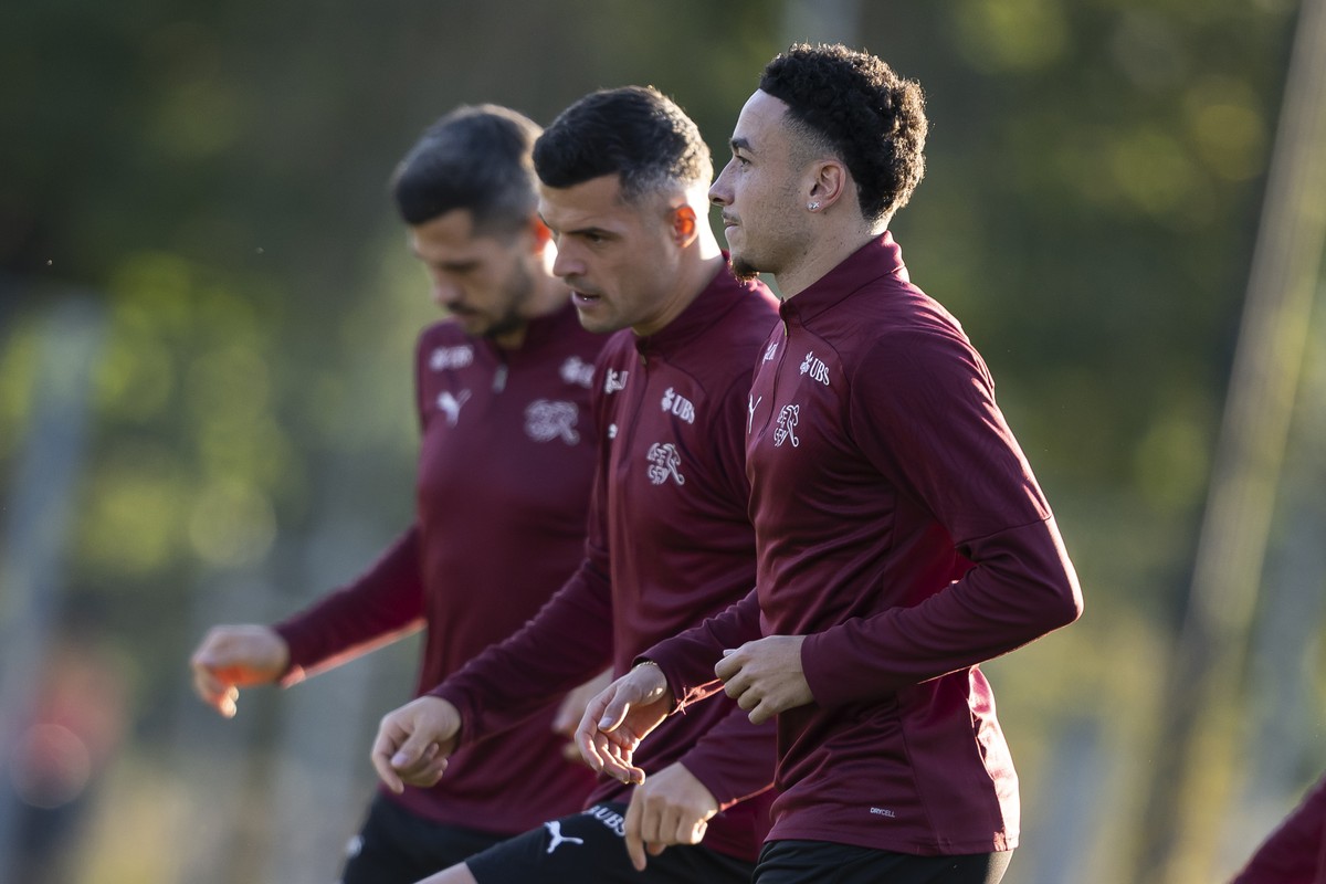 Switzerland's Ruben Vargas, Switzerland's Granit Xhaka, and Switzerland's Remo Freuler, right from left, in action during a training session one day prior to the FIFA World Cup 26 UEFA  ...