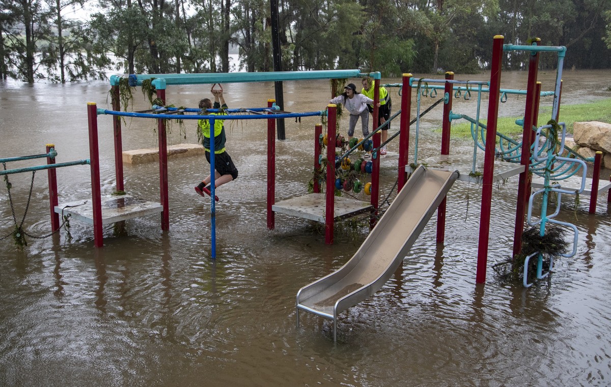 People play on equipment at a playground on the banks of the Nepean River at Jamisontown on the western outskirts of Sydney Monday, March 22, 2021. Australia's most populous state of New South Wa ...
