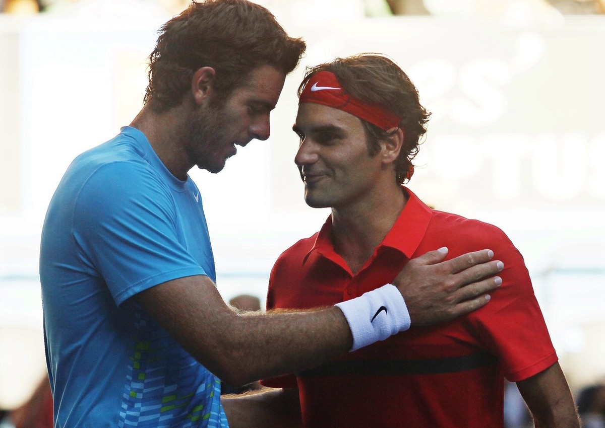 epa03075416 Roger Federer (R) of Switzerland is congratulated by Juan Martin Del Potro (L) of Argentina after their men's quarter final match at the Australian Open Grand Slam tennis tournament i ...