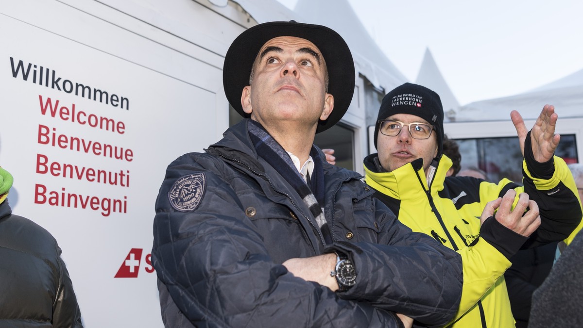 Swiss President Alain Berset, left, talks to Andreas Rickenbacher, former politician and head of marketing of the races, in the finish area ahead of the men's downhill race at the Alpine Skiing F ...
