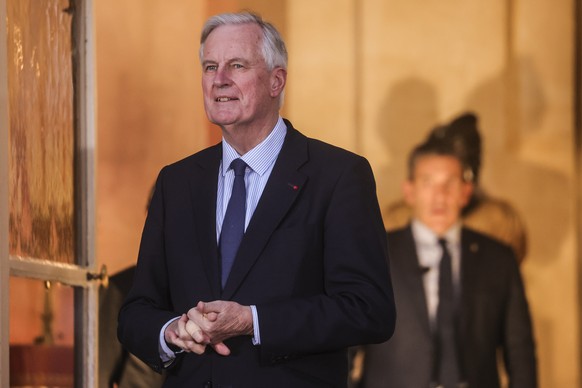 epa11775359 France&#039;s outgoing Prime Minister Michel Barnier awaits the arrival of France&#039;s newly appointed Prime Minister Francois Bayrou (unseen) during the handover ceremony at the Hotel M ...
