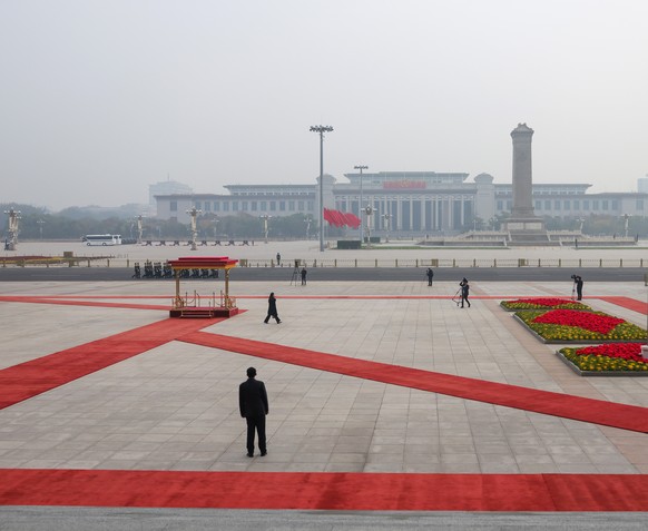epa12519634 National flag of Spain flies atop a pole with a general view of Tiananmen Square seen in the background before a welcoming ceremony by Chinas President Xi Jinping for King of Spain Felipe ...