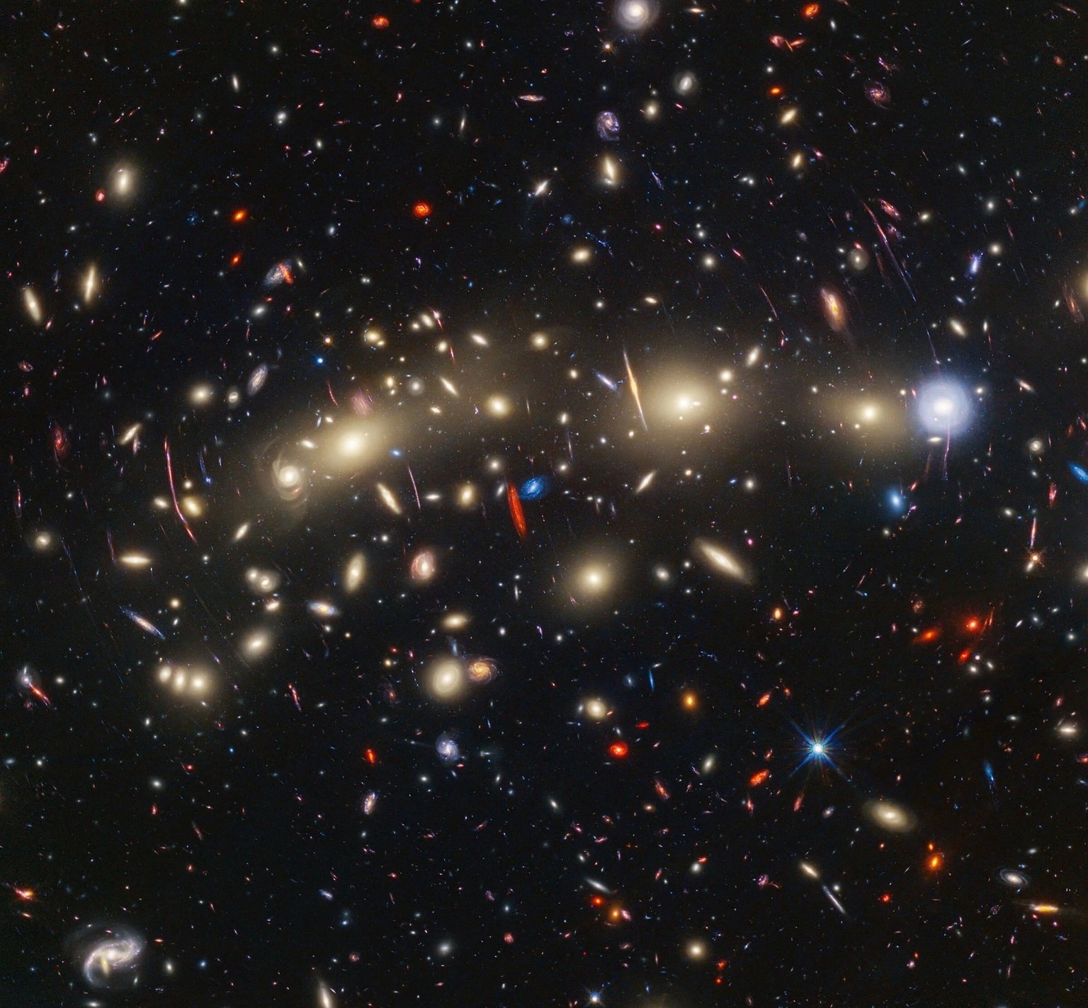 Galaxy cluster MACS 0416 This image of galaxy cluster MACS0416 was created by combining infrared observations from the James Webb Space Telescope with visible-light data from the Hubble Space Telescope...