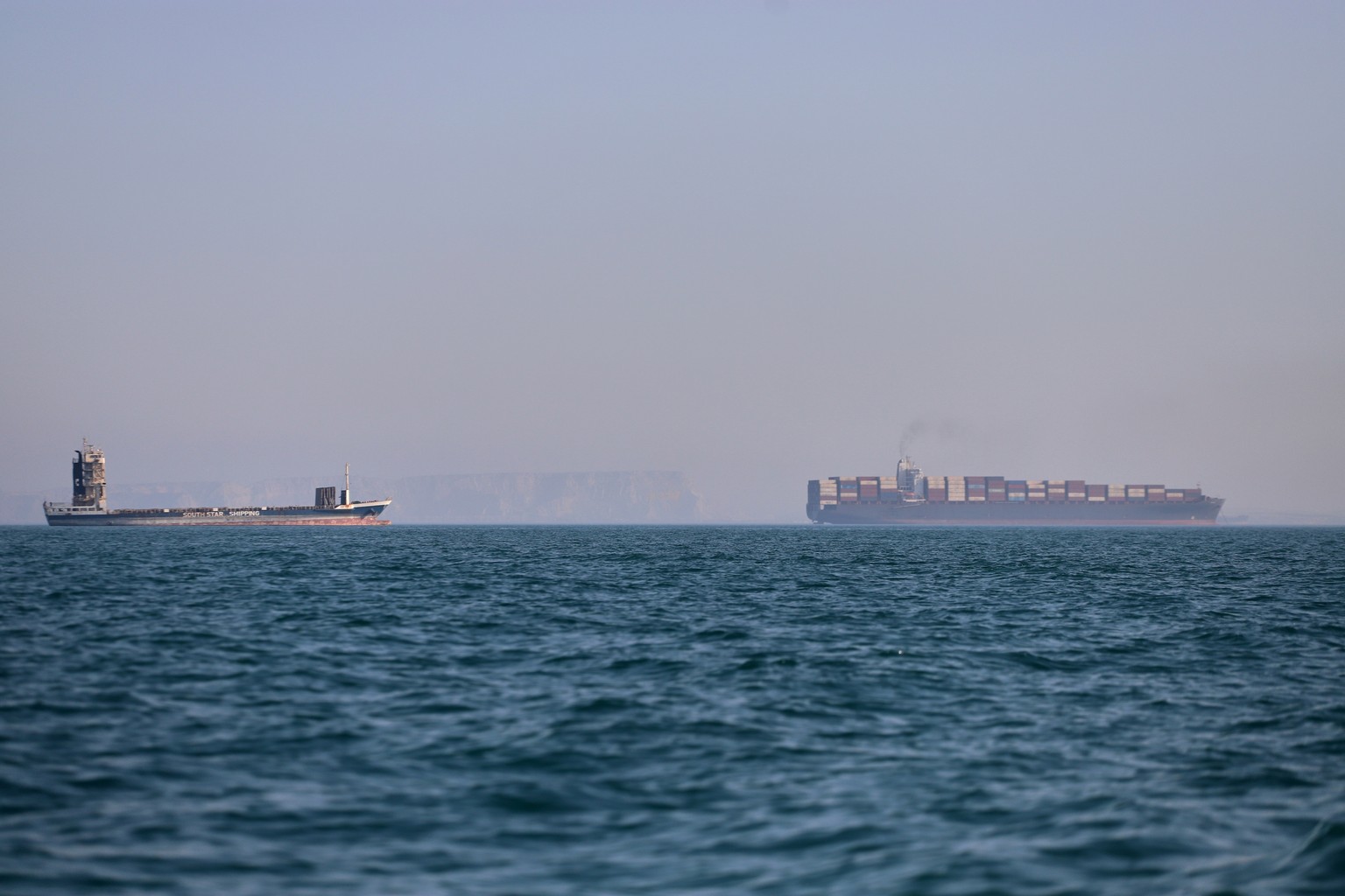 A container ship, right, and a cargo vessel are seen in the Strait of Hormuz off Bandar Abbas, Iran, Wednesday, June 17, 2026. (Amirhosein Khorgooi/ISNA via AP)
Iran War Strait of Hormuz