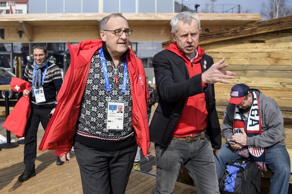 Switzerland's Federal Councillor Guy Parmelin, right, reacts next to Nicolas Bideau, head of Presence Suisse, right, as they visit the House of Switzerland at the XXIII Winter Olympics 2018 in Pyeongchang, South Korea, on Friday, February 23, 2018. (KEYSTONE/Jean-Christophe Bott)
