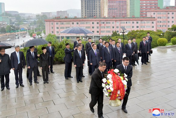 epa06708121 A photo released by the North Korean Central News Agency (KCNA), the state news agency of North Korea, shows Wang Yi, state councilor and foreign minister of the People&#039;s Republic of  ...