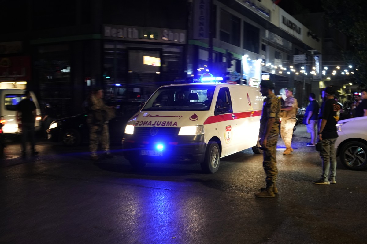 An ambulance carrying wounded people whose handheld pager exploded arrives outside at the American University hospital, in Beirut, Lebanon, Tuesday, Sept. 17, 2024. (AP Photo/Hassan Ammar)