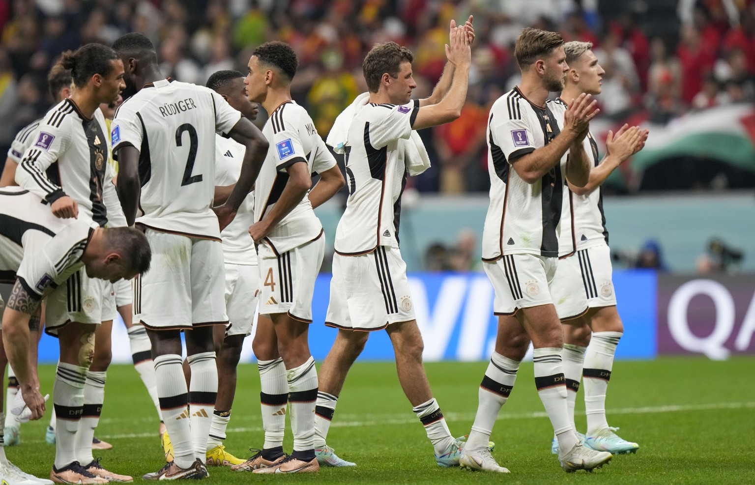 Germany players celebrate at the end of the World Cup group E soccer match between Spain and Germany, at the Al Bayt Stadium in Al Khor , Qatar, Sunday, Nov. 27, 2022. (AP Photo/Luca Bruno)