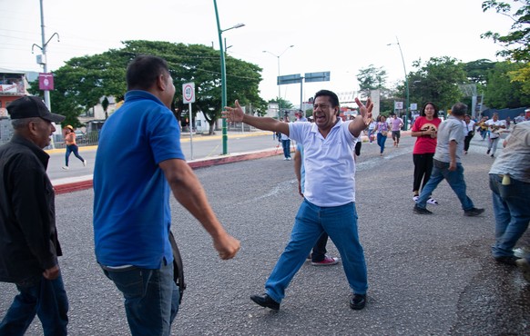 epa10720115 Relatives greet some of the 16 Ministry of Public Security employees abducted by an armed group in the southern Mexican state of Chiapas on June 27;  after they were found alive in the...