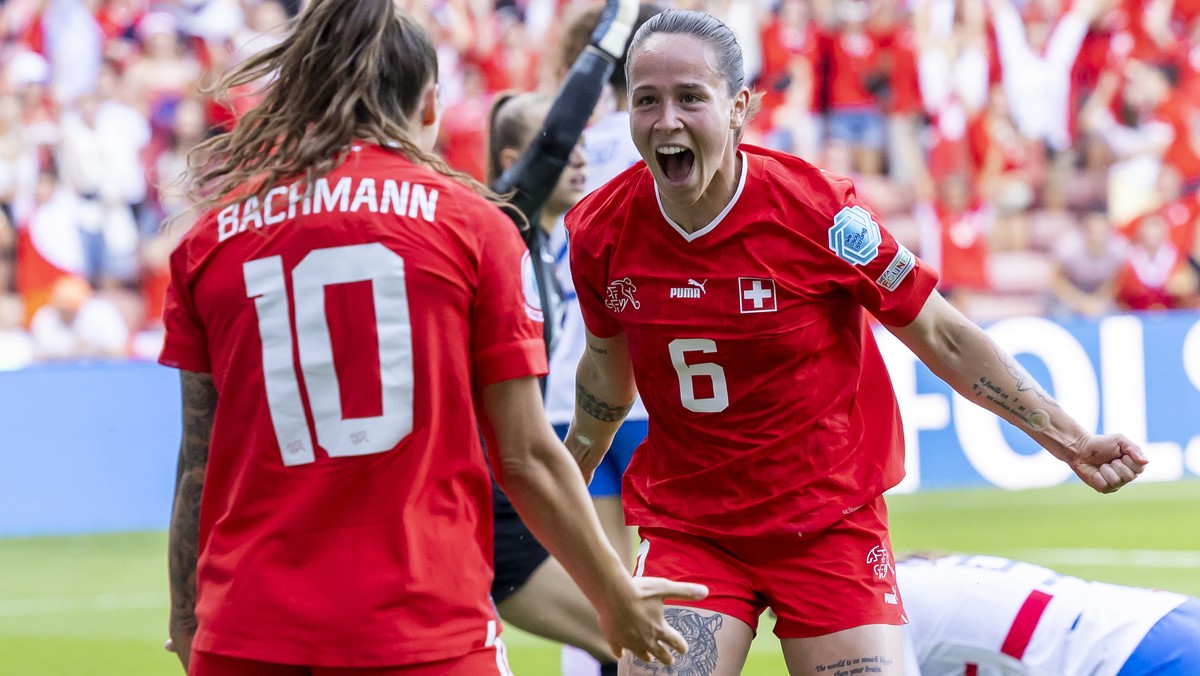 Switzerland's forward Geraldine Reuteler, right, celebrates her goal with teammate Switzerland's forward Ramona Bachmann, left, after scoring the 1:1, during the UEFA Women's England 20 ...