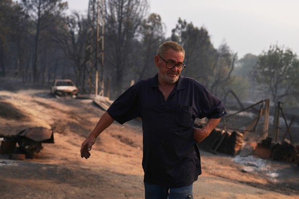 Paulino Dominguez, 62, checks his property burned by a wildfire, in Piedralaves, Ávila province, Spain, as the fire continues to spread, Tuesday, July 28, 2026. (AP Photo/Manu Fernandez)
Spain Wildfir ...
