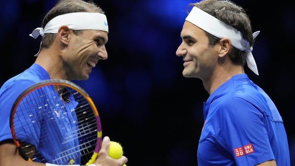 Team Europe's Roger Federer, right, and Rafael Nadal react during their Laver Cup doubles match against Team World's Jack Sock and Frances Tiafoe at the O2 arena in London, Friday, Sept. 23, 2022. (AP ...