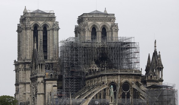 View of the Notre Dame cathedral after the fire in Paris, Tuesday, April 16, 2019. A catastrophic fire engulfed the upper reaches of Paris' soaring Notre Dame Cathedral as it was undergoing renovations Monday, threatening one of the greatest architectural treasures of the Western world as tourists and Parisians looked on aghast from the streets below. (AP Photo/Kamil Zihnioglu)
