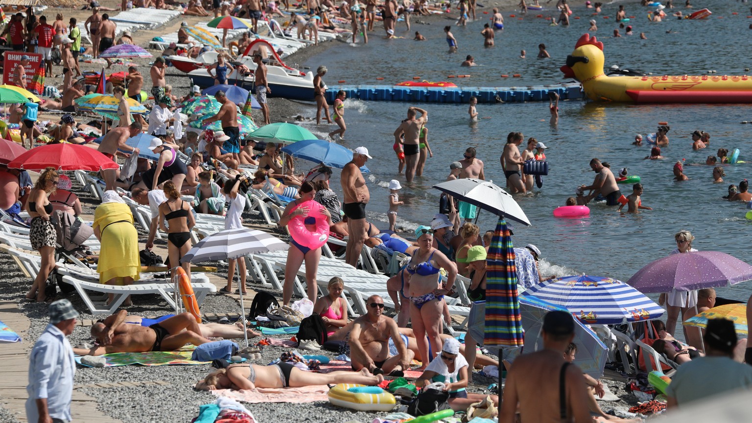 epa10778089 People enjoy a day on a Black Sea beach in Alushta, Crimea, July 24, 2023 (released July 31, 2023).  Crimea was annexed by Russia in 2014, shortly after Crimea voted in favor of a disputed referral.