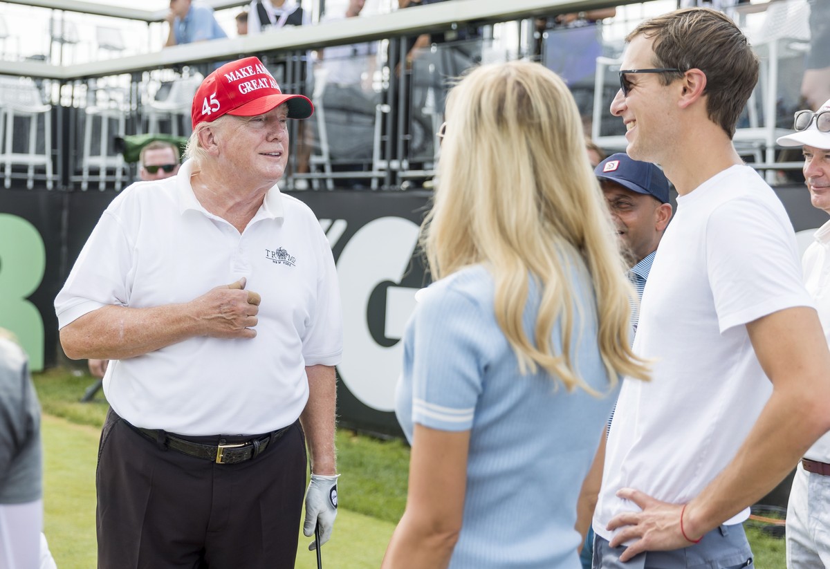 epa10096267 Former US President Donald J. Trump (L) talks with his daughter Ivanka Trump (C) and her husband Jared Kushner on the 1st tee during a Pro-Am tournament leading up to the LIV Golf Bedminst ...