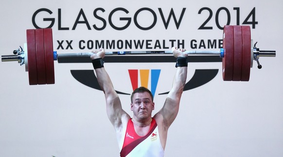 GLASGOW, SCOTLAND - JULY 30: Ben Watson of England lifts during the Men&#039;s Weighlifting 75kg Group A Final at Scottish Exhibition And Conference Centre during day seven of the Glasgow 2014 Commonw ...