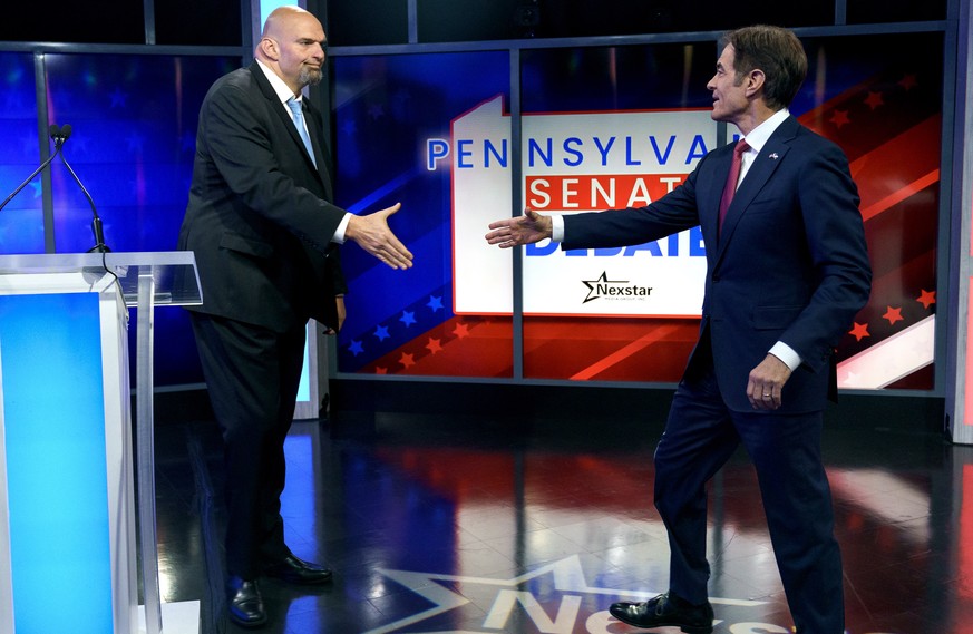 epa10266297 A handout photo made available by abc27 shows Democratic candidate Lt. Gov. John Fetterman (L) and Republican Pennsylvania Senate candidate Dr. Mehmet Oz (R) shaking hands prior to the Nex ...