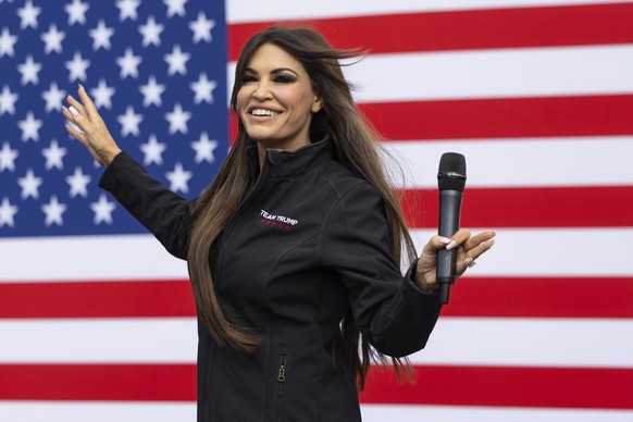 Kimberly Guilfoyle, former advisor to Donald Trump and girlfriend of Donald Trump Jr., dances as she arrives on stage during a campaign event for Pennsylvania Republican candidates at Montage Mountain ...