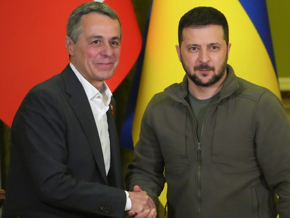 Ukrainian President Volodymyr Zelenskyy, right, shakes hands with Swiss President Ignazio Cassis in Kyiv, Ukraine, Thursday, Oct. 20, 2022. (KEYSTONE/AP Photo/Efrem Lukatsky)