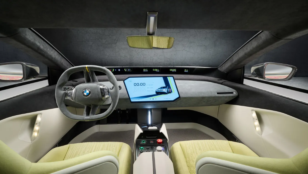 Minimalistischer Innenraum: Der neue i3 verzichtet auf klassische Schalter und setzt auf ein zentrales Touch-Display und ein Head-up-Display im Panoramaformat.