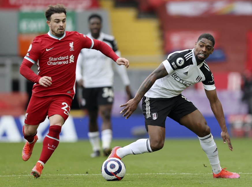 epa09059507 Xherdan Shaqiri (L) of Liverpool in action against Ivan Cavaleiro (R) of Fulham during the English Premier League soccer match between Liverpool FC and Fulham FC in Liverpool, Britain, 07  ...