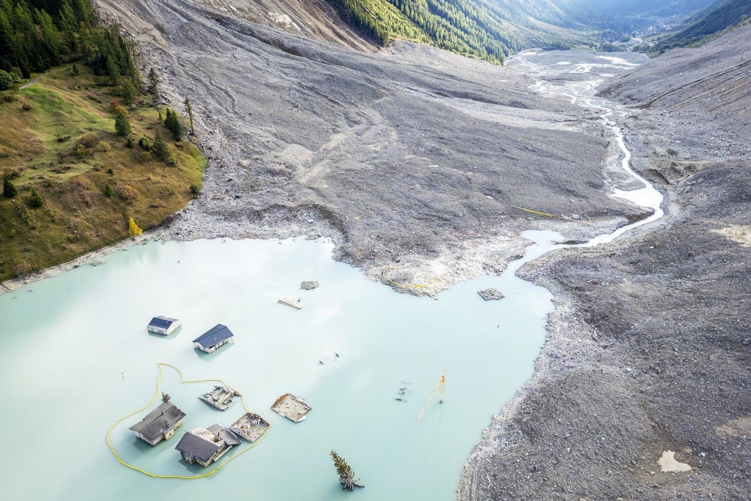 An aerial view shows the path of the landslide and the destroyed village, 4 months after a landslide destroyed the village, in Blatten, Switzerland, on Tuesday, September 30, 2025. On May 28, 2025, th ...