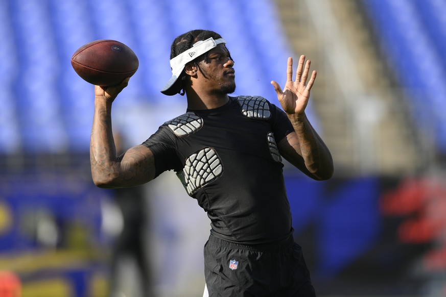 Baltimore Ravens quarterback Lamar Jackson works out prior to an NFL preseason football game against the New Orleans Saints, Saturday, Aug. 14, 2021, in Baltimore. (AP Photo/Nick Wass)