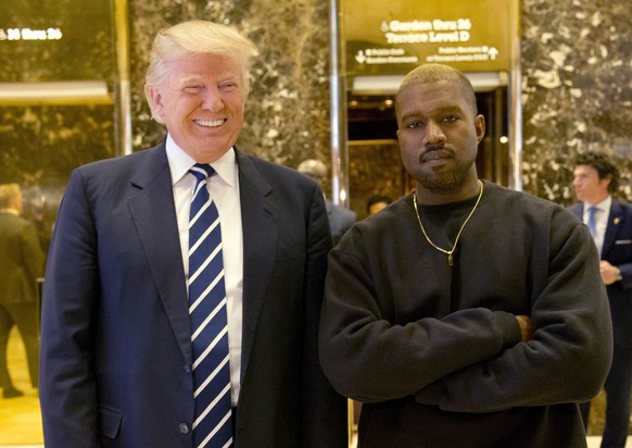 FILE - In this Dec. 13, 2016, file photo, President-elect Donald Trump and Kanye West pose for a picture in the lobby of Trump Tower in New York. West has deleted tweets posted on Dec. 13, 2016, expla ...