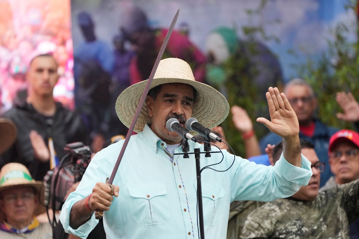 President Nicolas Maduro addresses supporters during a rally marking the anniversary of the Battle of Santa Isabel, which took place during Venezuela's 19th-century Federal War, in Caracas, Venez ...