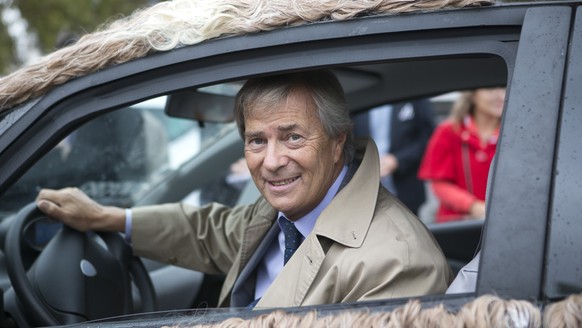 Vincent Bollore, head of the Bollore Group, sits in a modified Autolib electric car, Wednesday, October 1.  December 8, 2014 in Paris.  Nine modified versions of the Autolib will drive in Paris to show their…