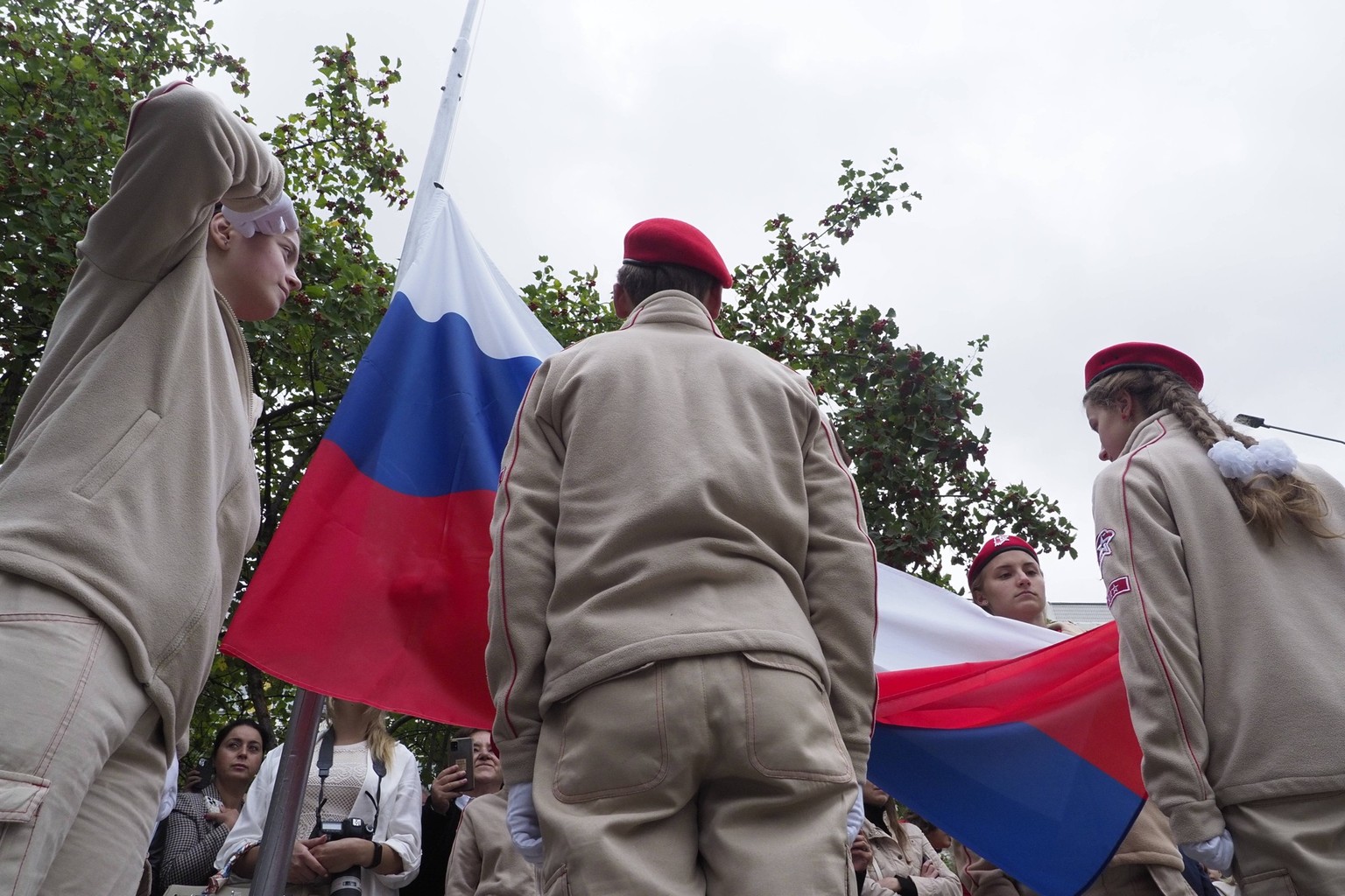 01.09.2022. Russia, Moscow. School students on the celebratory assembly devoted to Knowledge Day. Ceremony of a raising of the Russian flag. KonstantinxKokoshkin