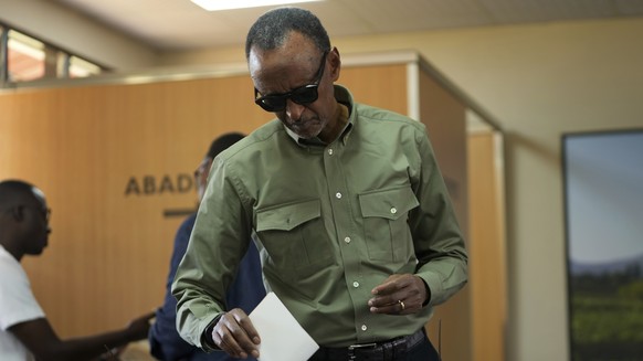 Rwanda&#039;s President Paul Kagame casts his vote in a presidential election, in Kigali, Monday, July. 15, 2024. Rwandans are voting Monday in a presidential election that is expected to extend the l ...