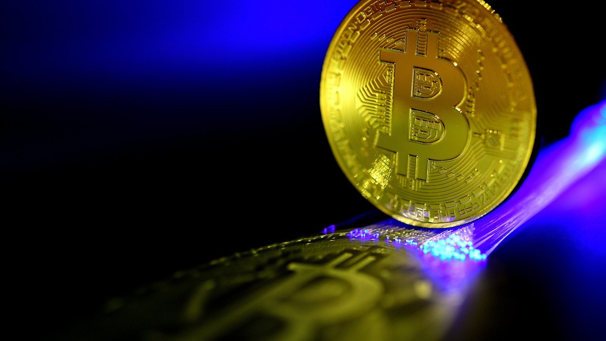 epa06407080 A Bitcoin is pictured in Duesseldorf, Germany, 27 December 2017. Wild swings in the price of bitcoin took a pause, after it temporarily dropped to 10,800 US dollar. The cryptocurrency' ...