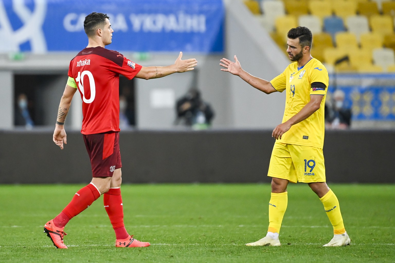 epa08644974 Switzerland&#039;s midfielder Granit Xhaka, left reacts next to Ukraine&#039;s forward Junior Moraes, right, during the UEFA Nations League group 4 soccer match between Ukraine and Switzer ...