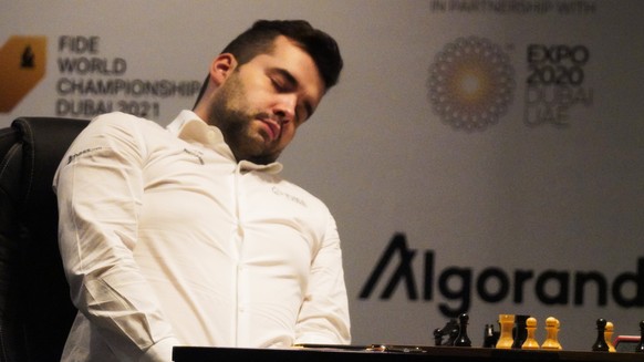 Ian Nepomniachtchi of Russia reacts before losing the FIDE World Championship at Dubai Expo 2020 in Dubai, United Arab Emirates, Friday, Dec. 10, 2021. (AP Photo/Jon Gambrell)
Ian Nepomniachtchi,Magnu ...