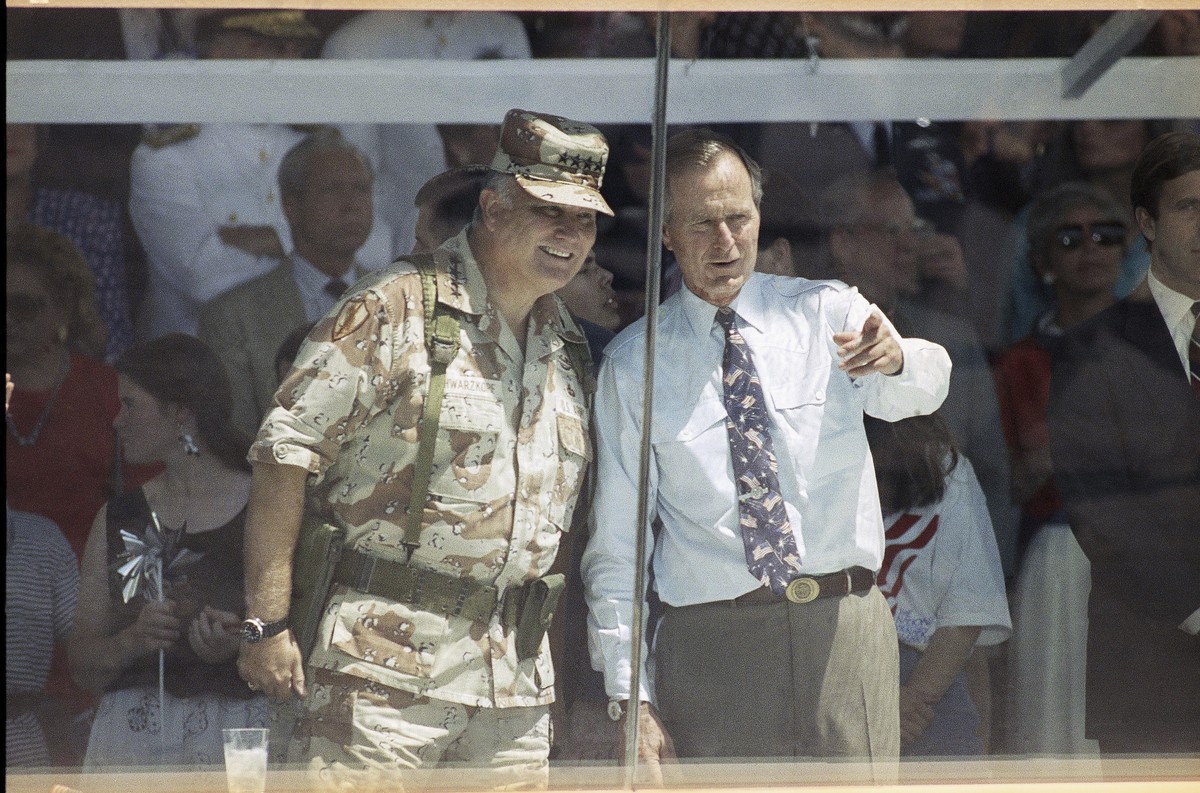 FILE - Gen. Norman Schwarzkopf, left, and President George HW Bush watch the National Victory Parade in Washington, June 8, 1991, after Schwarzkopf led his troops in the parade, and then joined Bush i ...