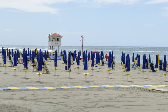 May 18, 2025, Rome, Italy: Closed umbrellas on a cloudy day on a beach in Lido di Ostia, the coastal area of Ãâ¹Ãâ¹Ãâ¹Ãâ¹Rome. Rome Italy - ZUMAv147 20250518_zip_v147_045 Copyright: xMarcelloxValerix