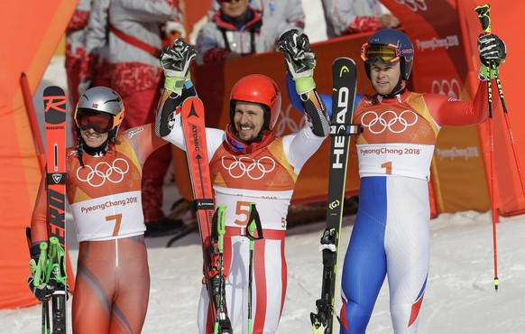 Norway&#039;s Henrik Kristoffersen, silver, Austria&#039;s Marcel Hirscher, gold, and France&#039;s Alexis Pinturault, bronze, from left, celebrate in the finish area of the men&#039;s giant slalom at ...