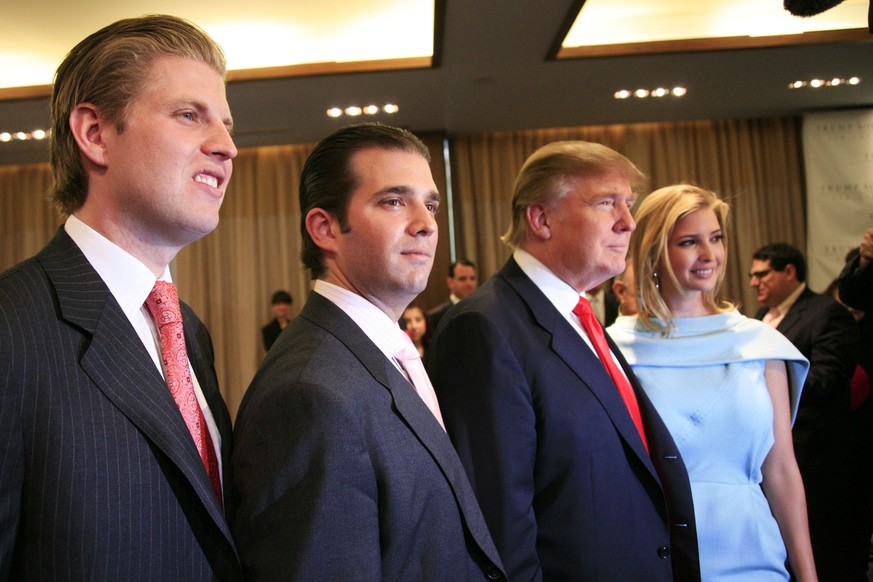 FILE - In this April 9, 2010 file photo, Donald Trump, chairman and CEO of the Trump Organization, poses with his children Eric, left, Donald Jr., second left, and Ivanka, at the opening of the Trump  ...