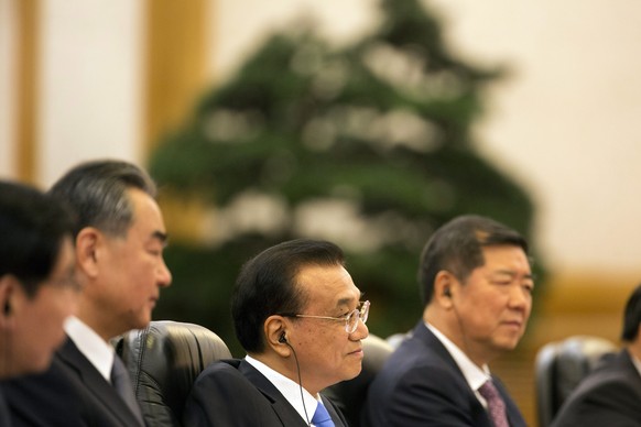 epa06892320 Chinese Premier Li Keqiang (C) meets with European Council President Donald Tusk and European Commission President Jean-Claude Juncker (not pictured) at the Great Hall of the People in Bei ...