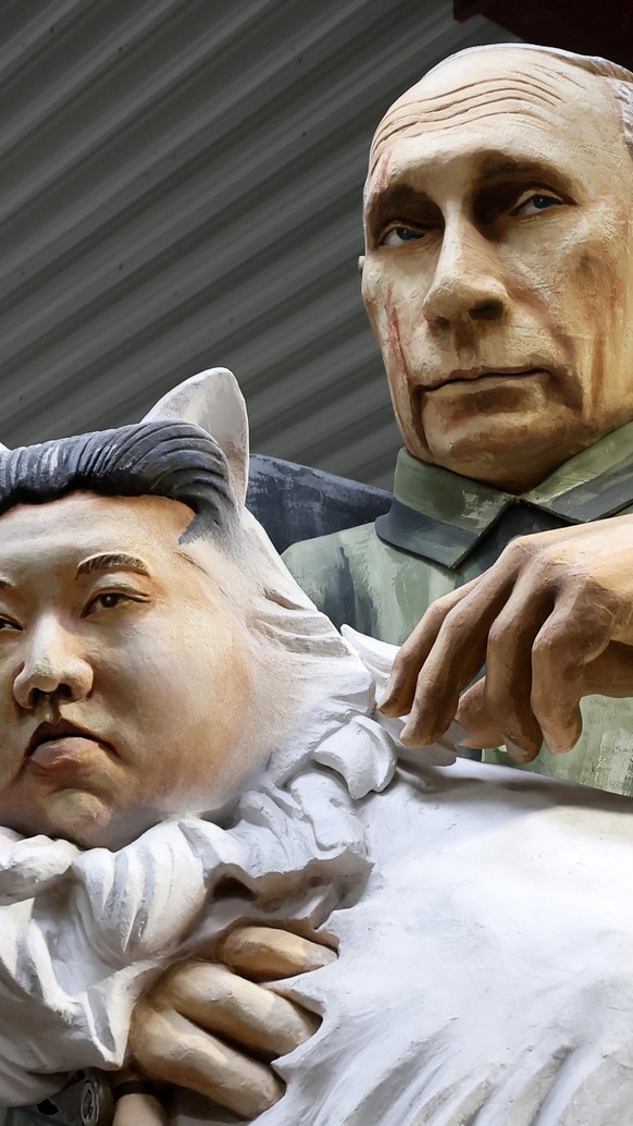 epaselect epa11923145 A carnival float titled &#039;On a deadly mission&#039; depicting the Russian President Vladimir Putin and North Korean leader Kim Jong Un is presented by the Mainz Carnival Asso ...