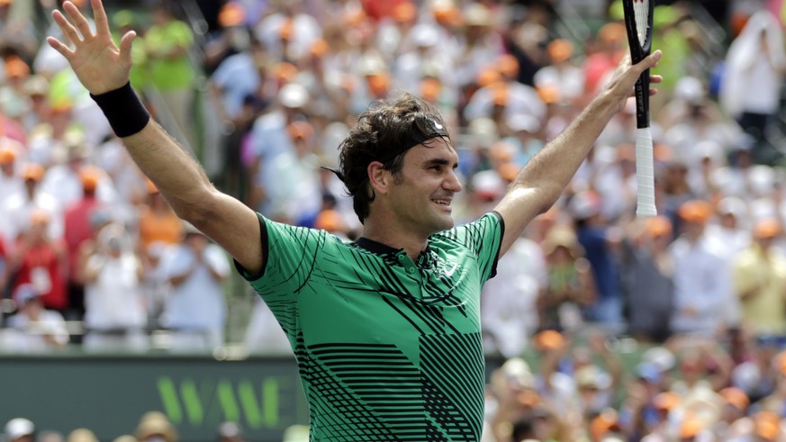 Roger Federer, of Switzerland, celebrates after defeating Rafael Nadal, of Spain, in the men's singles final at the Miami Open tennis tournament, Sunday, April 2, 2017, in Key Biscayne, Fla. (AP Photo ...