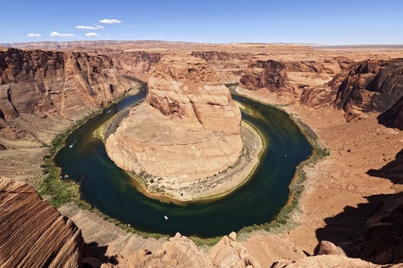 FILE - The Colorado River flows at Horseshoe Bend in Glen Canyon National Recreation Area, Wednesday, June 8, 2022, in Page, Ariz. In Arizona, water officials are concerned, though not panicking, abou ...